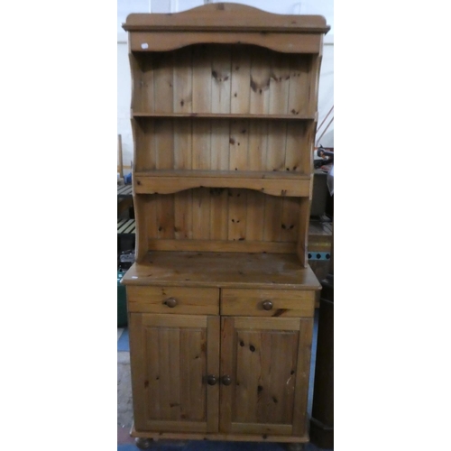 A Small Pine Kitchen Dresser With Two Drawers Over Cupboard Base