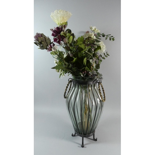 A Large Modern Glass Vase In Wrought Iron Surround With Collection