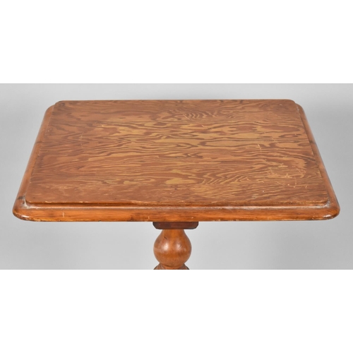 18 - A Late Victorian Pitch Pine Tripod Table. 59x49x73cms