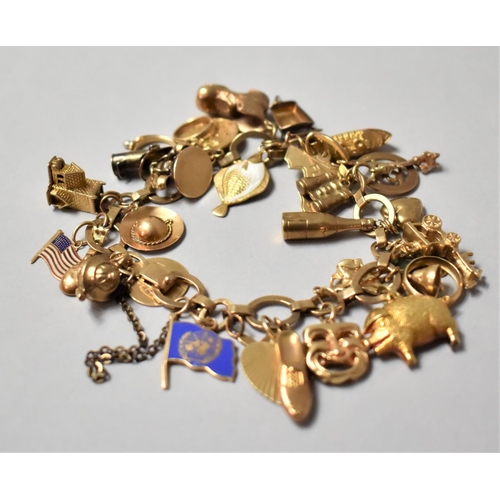 A Very Heavy 9ct Gold Charm Bracelet by AC and Co, together with Quantity of 9ct, 10ct, 14ct Gold Charms, Plus some Yellow Metal Examples. Charms to Include Enamelled Plaice, Lute, Champagne Bottle, Pig, Steamer Ship, Enamelled Clover, Ecclesiastic Examples Etc, 57gms.