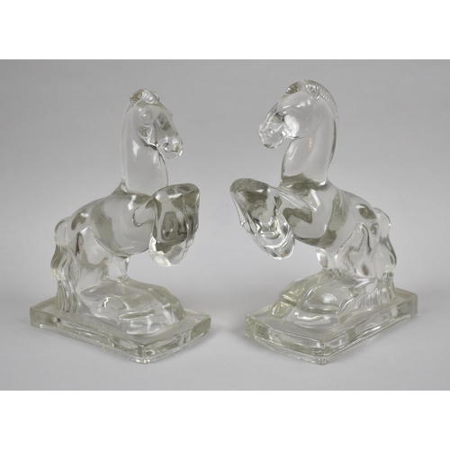 30 - A Pair of Glass Bookends in the Form of Rearing Stallions, 20cms High