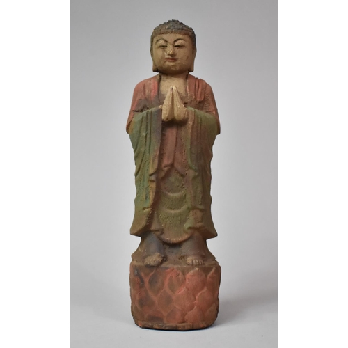 333 - A Carved Chinese Wooden Figure with Polychrome Decoration, 30cm high
