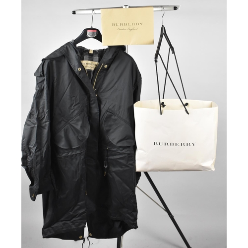 258 - An Unused Burberry Chiltondale Black Raincoat with Hood, with Bag, Shipping Note and Receipt