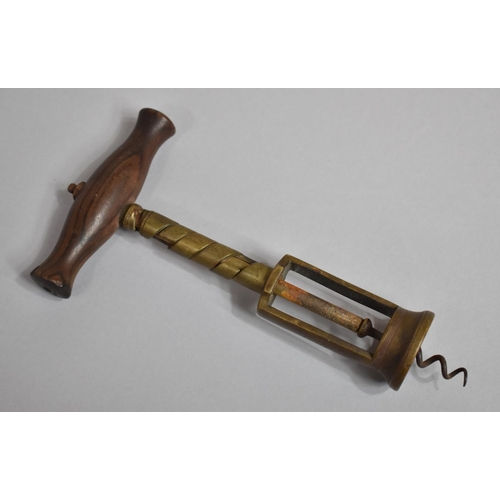 267 - A Rare G Dowler's Patent Chinnock Snail Type Brass and Wooden Handled Corkscrew. 21cms Long