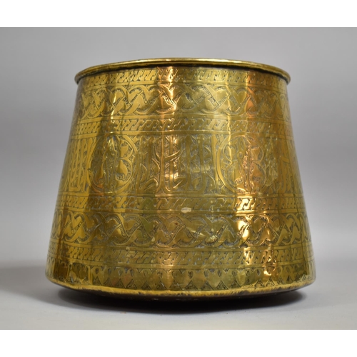 55 - An Indian Engraved Brass Bucket of Circular Tapering Form with Islamic Decoration, 25cm Diameter and... 