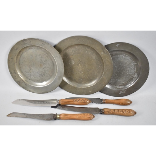 58 - Three Pewter Plates and Four French Bread Knives