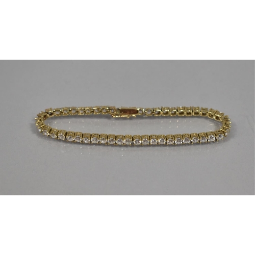 37 - A 9ct Gold and CZ Tennis Bracelet, 50 CZs, each 0.12 Carat (Approx), 18cms Long, 10.4gms