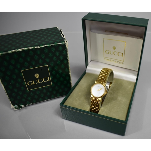 20 - A Ladies Gucci Wrist Watch, Model 3400L, Mother of Pearl Dial and Gold Coloured Hands, Face Inscribe... 