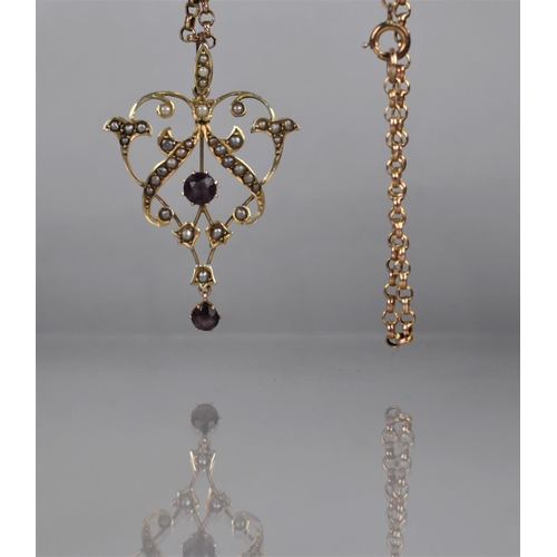 57 - A 9ct Gold Edwardian Purple Stone and Pearl Pendant on a 9ct Gold Belcher Chain. Openwork Foliate Pe... 