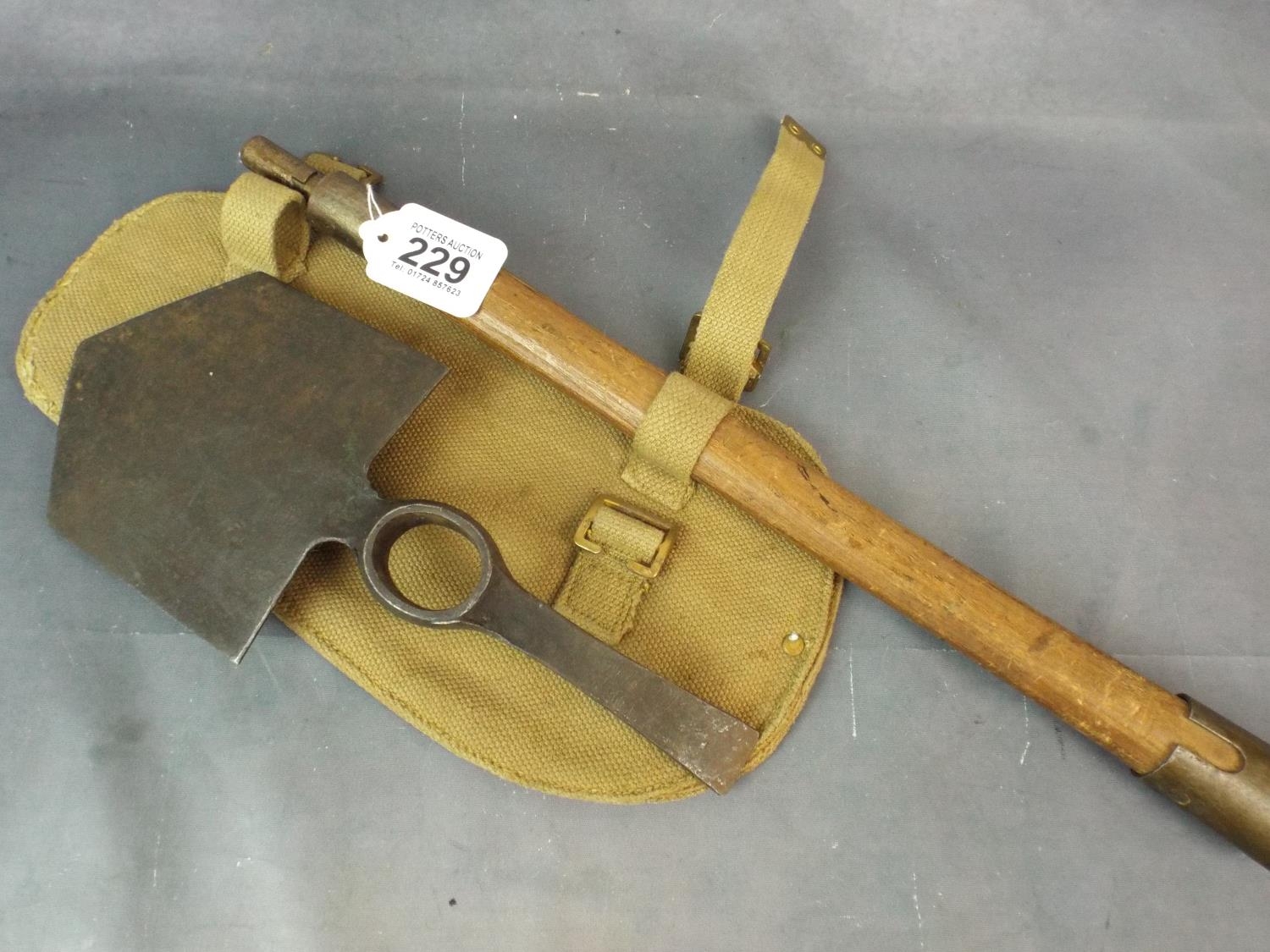 WW2 Trenching tool with webbing carry case. Arrowmarked and stamped for ...