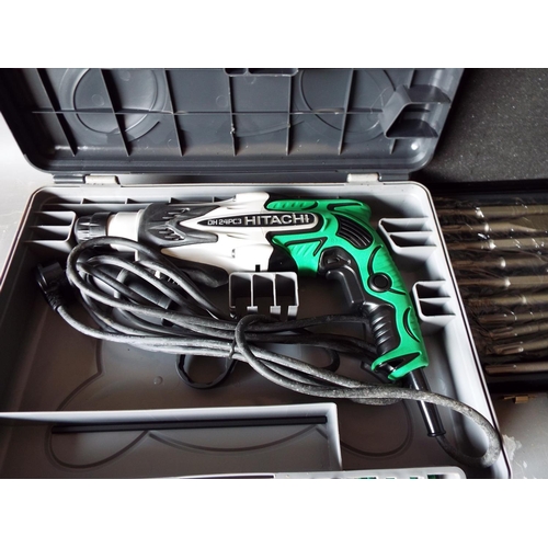 Hitachi KOKI 24mm rotary hammer drill plus a new set of drill bits.