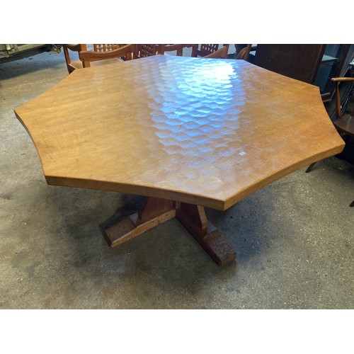 1261 - A large Robert ''Mouseman'' Thompson Oak octagonal adzed top and sides table with curved edges to to... 
