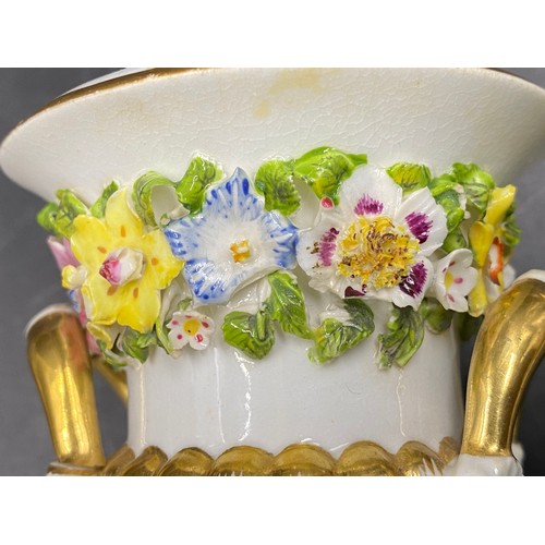 59 - Three pieces of Bloor Derby porcelain to include a pair of floral urns 18cms together with a lidded ... 