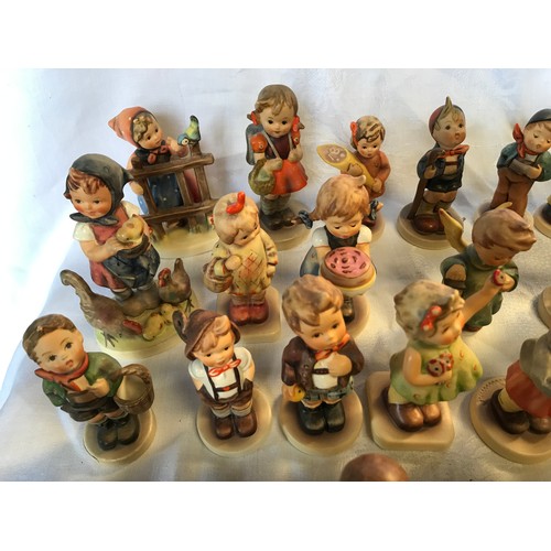 50 - A collection of 35 small Hummel figurines.