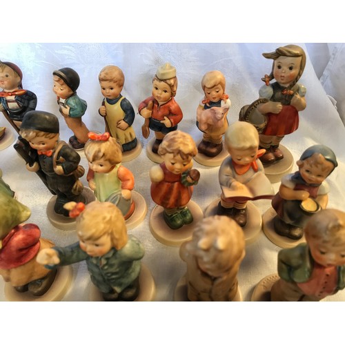50 - A collection of 35 small Hummel figurines.