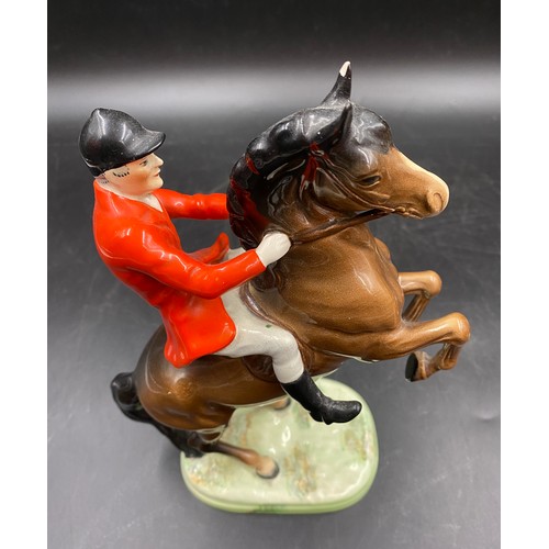 22 - A Beswick figure of a huntsman on a rearing horse 25cms h together with a Beswick fox 6cms h and 2 h... 