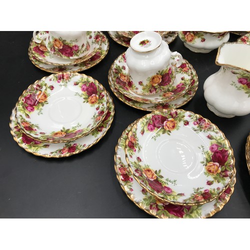 27 - A selection of Royal Albert Country Roses to include cake plate 26cms d, 12 plates 21cms d, 6 side p... 