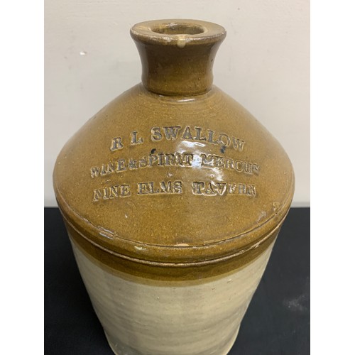 13 - A stoneware jar with R.L Swallow Wines and Spirit merchant Nine Elms Tavern to front. 35cms h.