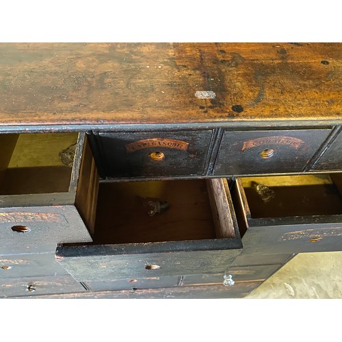 1178 - A 19thC pine 38 drawer drug run/chest with gilt and black labels and glass knobs to all drawers. 193... 