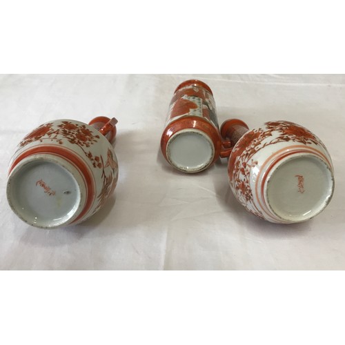 6 - A pair of Japanese Kutani ware pots with double handles and birds and floral pattern 18cms h togethe... 