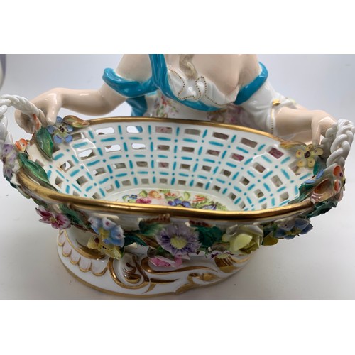 11 - A John Bevington figural sweetmeat basket modelled as a classical lady seated by a shell shaped oval... 