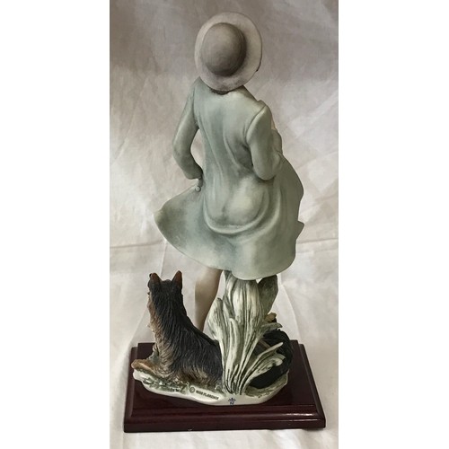 32 - A Florence figurine of a lady and a dog 36cms h by Giuseppe Armani.