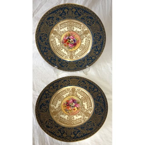 37 - Two Royal Worcester hand painted plates 27cm d depicting flowers. Signed J Stanley