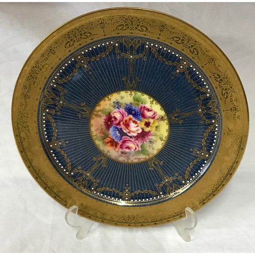 40 - Royal Worcester plate signed J Stanley, 27cm d. Depicting flowers to the centre and raised decoratio... 