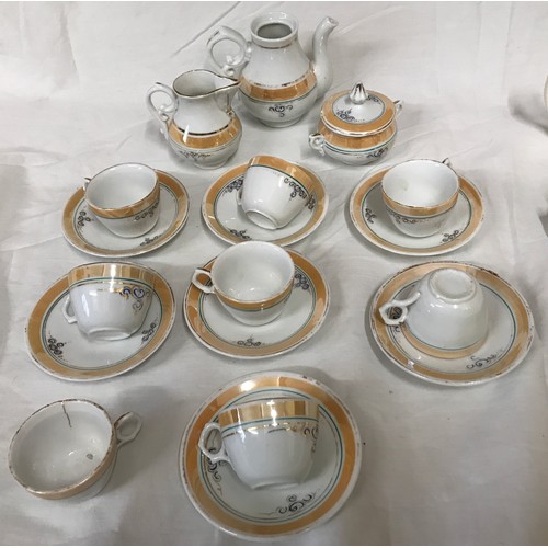 60 - Two children's tea sets, one brown and gilt rimmed 18 pieces and one white pottery 9 pieces tea for ... 