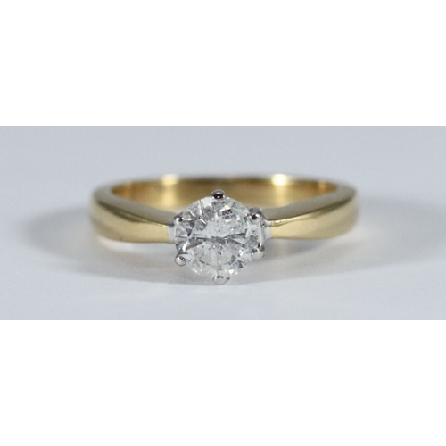 An 18ct gold solitaire diamond ring, six-claw set with a rou...