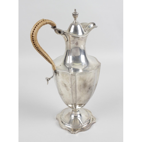 A George Iii Silver Lidded Jug The Shaped Footed Base Rising To A