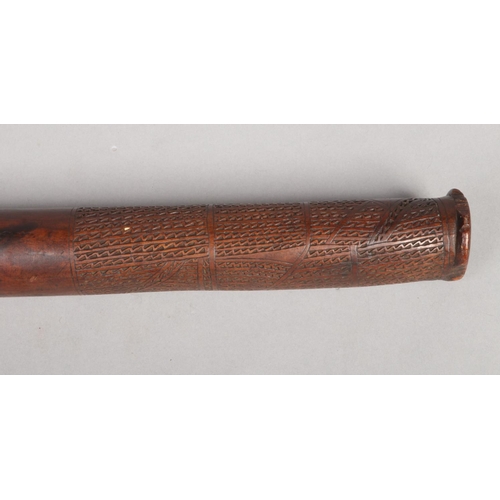 A 19th century Fijian gunstock war club. Carved to the grip with ...