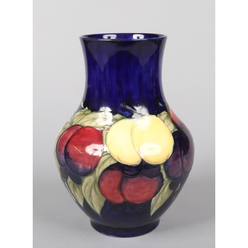 56 - A large Moorcroft vase decorated in the Wisteria pattern over a cobalt blue ground. Impressed mark a... 