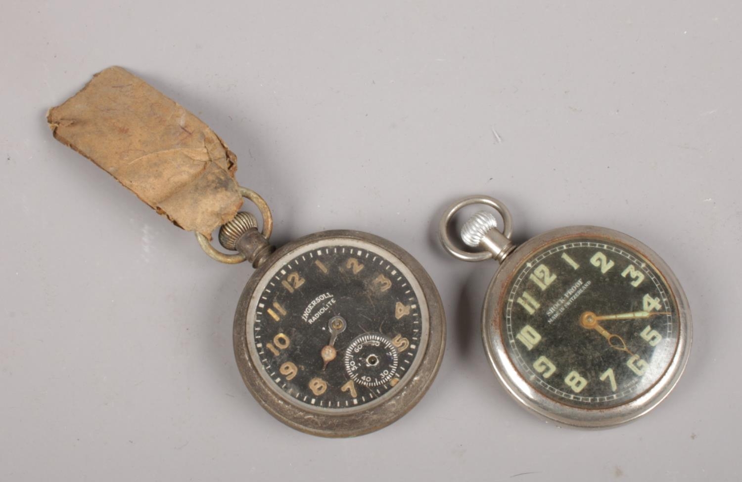 Two military style pocket watches. Ingersoll Radiolite and one other.