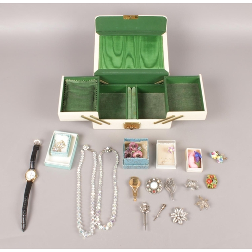 26 - A jewellery box containing mostly costume brooches. To include three boxed ceramic brooches, a pair ... 