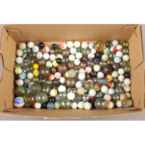 48 - A box of glass and metal marbles.