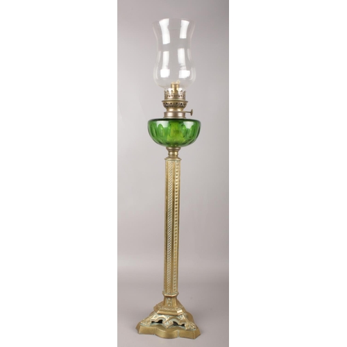 42 - A Victorian brass & glass oil lamp. 83cm height.