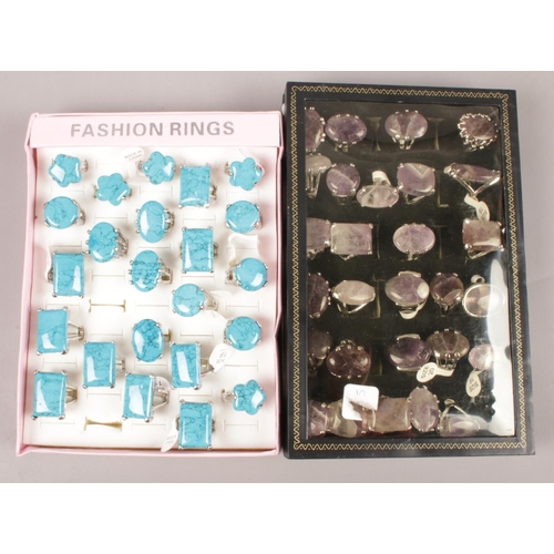 18 - Two display cases of fashion dress rings set with hardstones.