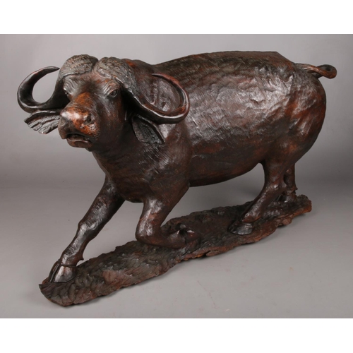 1 - An extremely large hardwood carving of a horned water buffalo. Length: 80cm.