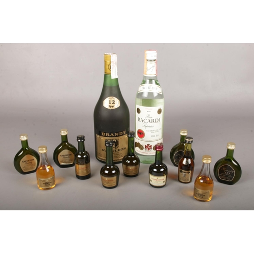 11 - A quantity of unopened Brandy & Rum. To include a 0,700L 12 year Napoleon Brandy, miniature Courvois... 