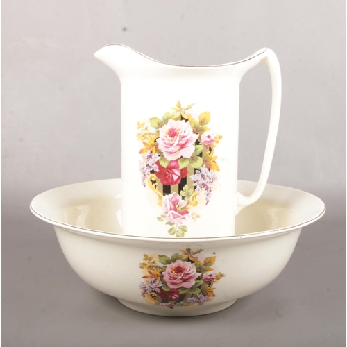 14 - A ceramic wash jug & bowl. 37cm height.