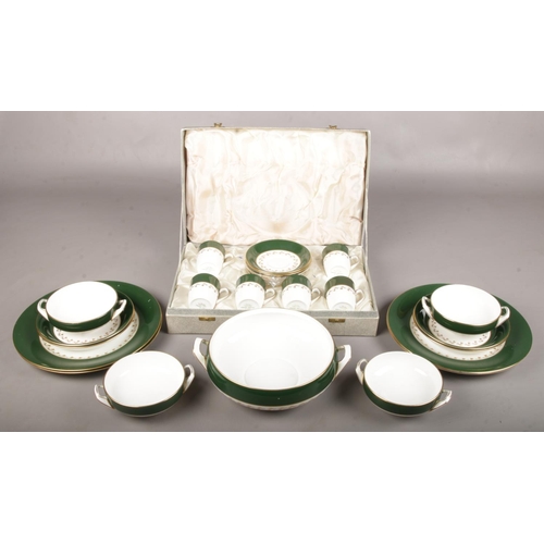 19 - A collection of Spode Green Velvet porcelain dinnerwares. Includes cased cups and saucers.