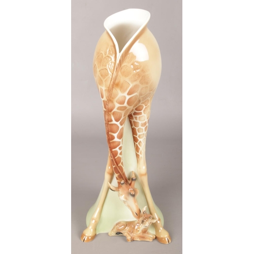 3 - A Large Ceramic Vase in the form of a Giraffe Licking her Calf, together with a Small Side Plate and... 