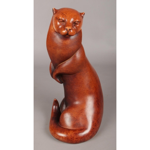 46 - A Large Border Fine Arts Polished Wooden Sculpture of an Otter. 33cm High.