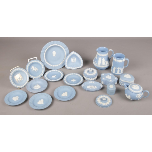 47 - A collection of eighteen pieces of Wedgwood blue Jasperware. To include jugs, trinket boxes / dishes... 