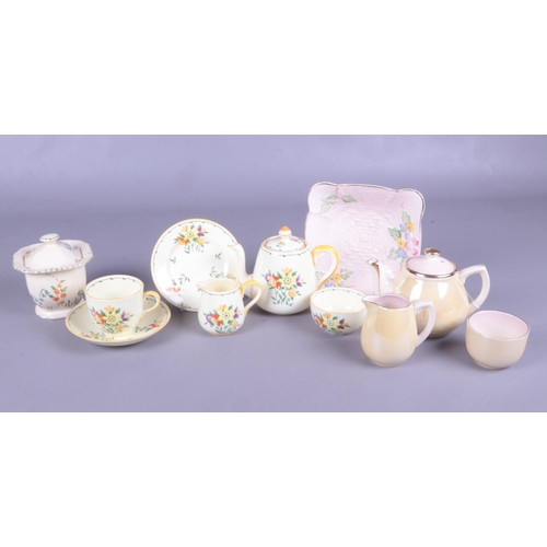 49 - A small selection of named miniature ceramics. To include a Crown Staffordshire part tea set, Royal ... 