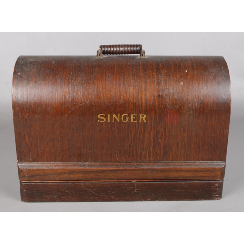 6 - A Cased Singer Sewing Machine.