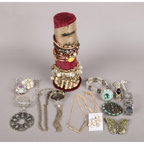 31 - A Quantity of Costume Jewellery. To include Bangles, Necklace and Rings.