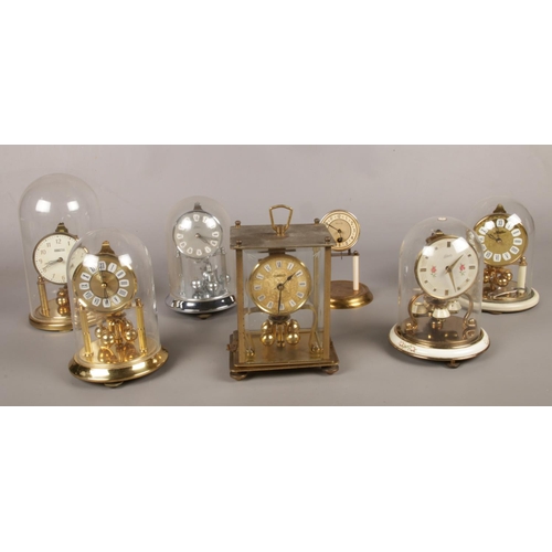 24 - A collection of brass torsion clocks. (7) Schatz, Kern, Haller.