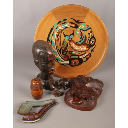 48 - A collection of wood and treen items. Includes turned barrel, tribal bust and carved miniature anima... 